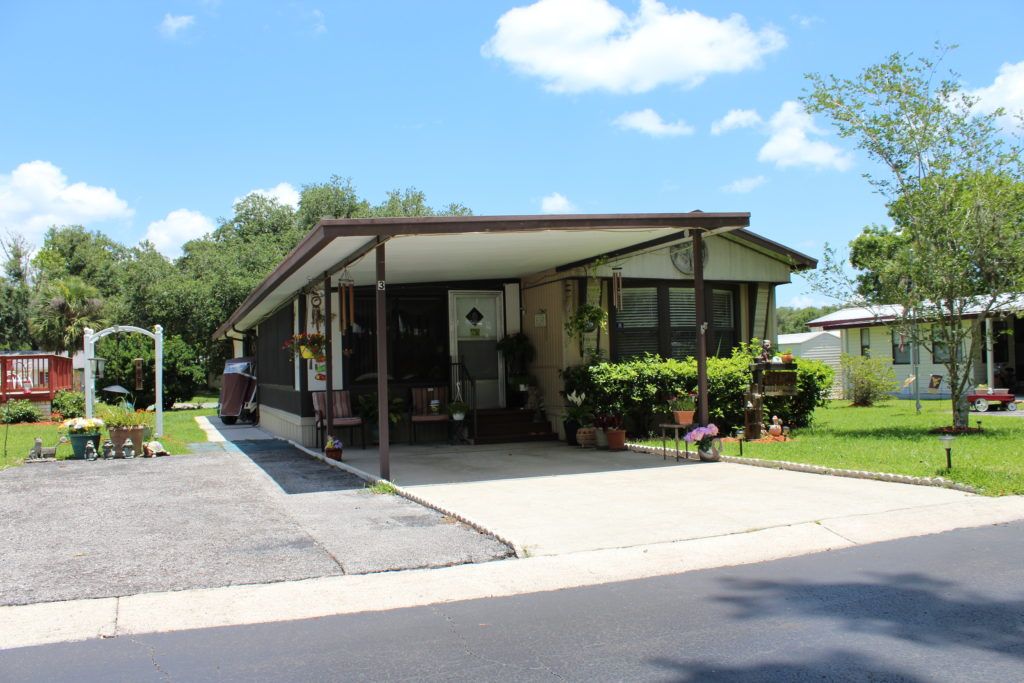 Mobile home with carport at 3 Seasons in Brooksville, FL